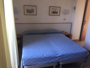 Postel nebo postele na pokoji v ubytování Hotel Man