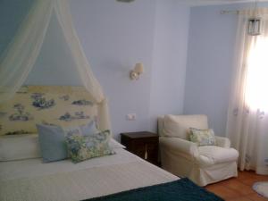 A bed or beds in a room at La Casa del Telar