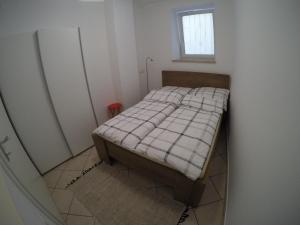 Кровать или кровати в номере Apartma Piran