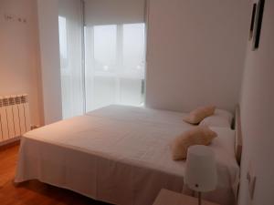 Łóżko lub łóżka w pokoju w obiekcie Apartamento Dicar