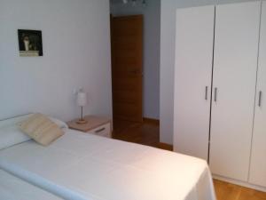 Łóżko lub łóżka w pokoju w obiekcie Apartamento Dicar