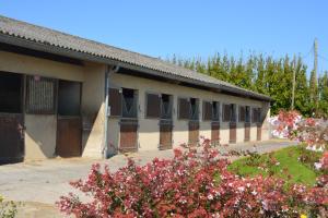 a building with a bunch of windows on it at gite Tombelaine in Pontorson