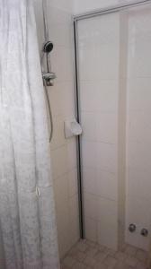 a bathroom with a shower with a shower curtain at Hotel Promenade in Milano Marittima