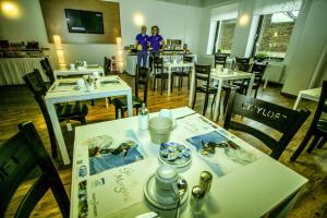 TV a/nebo společenská místnost v ubytování T3 Hotel Cityloft
