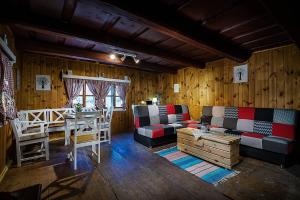 a living room with a couch and a table at Narnia Relax House - Liptov in Liptovský Mikuláš