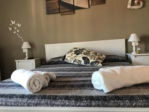 Postel nebo postele na pokoji v ubytování Spegni La Luce b&b