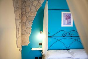 Postel nebo postele na pokoji v ubytování B&B Raffiori
