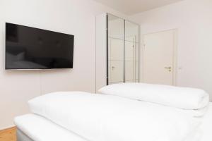Ein Bett oder Betten in einem Zimmer der Unterkunft KulturQuartier
