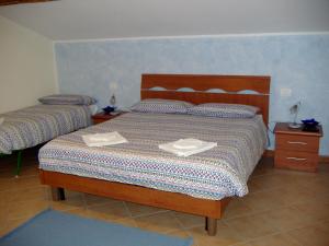 Postel nebo postele na pokoji v ubytování CUORE di GIULIETTA