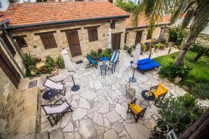 an overhead view of a patio with chairs and tables at Niki's House in Limassol