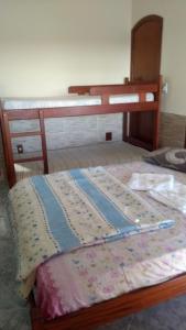 a bed in a room with at Pousada Da Restinga in Cabo Frio