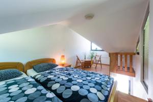 Postel nebo postele na pokoji v ubytování Apartments Jaka
