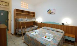 Postel nebo postele na pokoji v ubytování Hotel Sporting + 31 fotografií