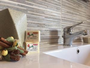 a kitchen counter with a sink and a faucet at Residenza Dama in Santa Domenica +33 photos