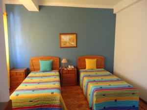 Postel nebo postele na pokoji v ubytování Hotel Conforto Latino