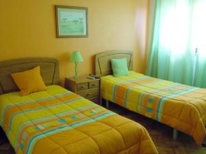 Postel nebo postele na pokoji v ubytování Hotel Conforto Latino