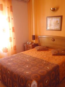 Postel nebo postele na pokoji v ubytování Hotel Conforto Latino