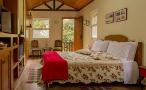 Cama ou camas em um quarto em Pousada Ribeirao da Floresta
