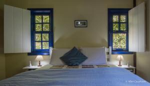 Cama ou camas em um quarto em Pousada Ribeirao da Floresta