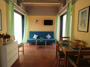A television and/or entertainment centre at Barbati Beach Apartments
