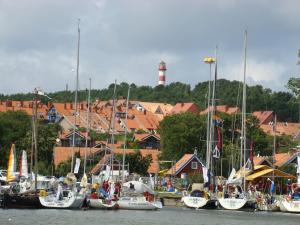 a bunch of boats are docked in a harbor at Apartamentai Dorė in Nida