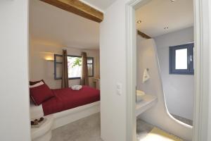 A bed or beds in a room at Alexandros Studios