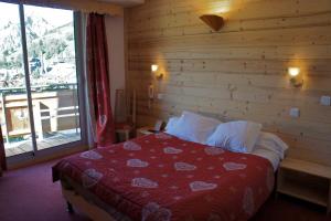 Voodi või voodid majutusasutuse Hotel Adret toas