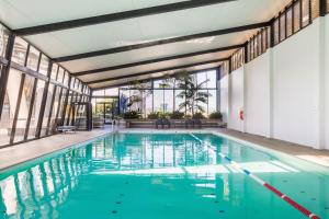 a swimming pool with blue water in a building at Holiday Holiday Circle On Cavill Apartments in Gold Coast