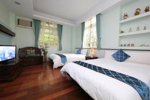 Sjónvarps- og/eða afþreyingartæki á Yilan Ya Lu Homestay