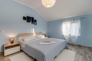 Postel nebo postele na pokoji v ubytování Apartman Leon & rent a quad