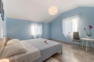 Postel nebo postele na pokoji v ubytování Apartman Leon & rent a quad