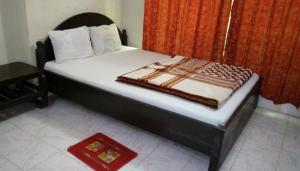 Llit o llits en una habitació de Hotel Green Land