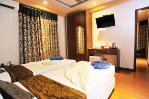 Letto o letti in una camera di Turquoise Residence by UI
