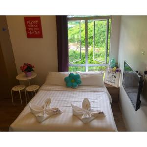 Postel nebo postele na pokoji v ubytování Hotel Flora Plus