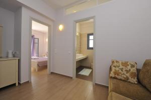 A bed or beds in a room at Alexandros Studios