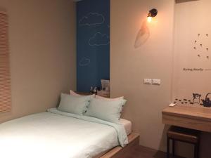 Voodi või voodid majutusasutuse Enjoy Homestay toas