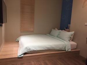 Voodi või voodid majutusasutuse Enjoy Homestay toas