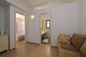 A bed or beds in a room at Alexandros Studios