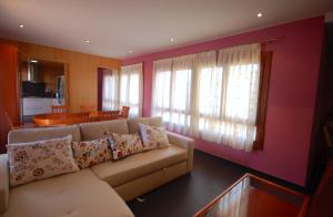 a living room with a couch and a table at Lets Holidays Palmera III in Tossa de Mar