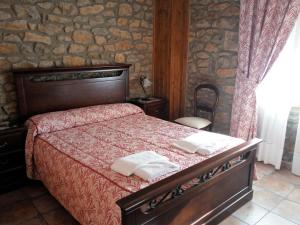 Giường trong phòng chung tại Hotel Rural La Piedra