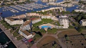 an aerial view of a resort with a marina at Residence Ulysse Port Camargue in Le Grau-du-Roi +18 photos