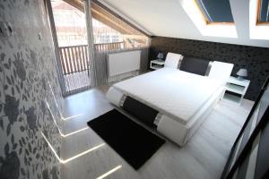 Postel nebo postele na pokoji v ubytování Centrum Lux Apartman