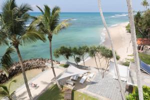 a view of the beach from the balcony of a resort at LakRaj Heritage in Matara