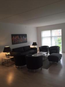 A seating area at City Lux apartment with 2 full bathrooms 2tv