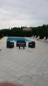 a swimming pool with lounge chairs and a swimming pool at Nina in Carcassonne +17 photos