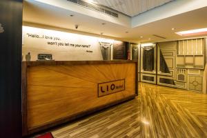 a lobby with a reception desk with a sign on it at Lio Hotel - Ximending in Taipei +11 photos