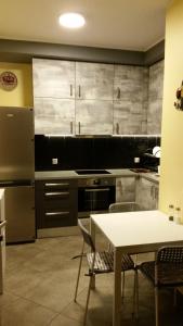 Kuchyňa alebo kuchynka v ubytovaní Apartament Osiedle Garnizon