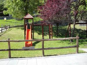 a playground with an orange slide in a park at Ristorante Bellavista in Santa Maria