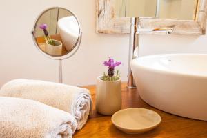 a bathroom with a sink and a mirror at Vivendes Adelina - Escapada Formentera in Es Pujols +33 photos