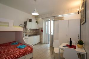 a small apartment with a bed and a kitchen at Villa Lole in Split